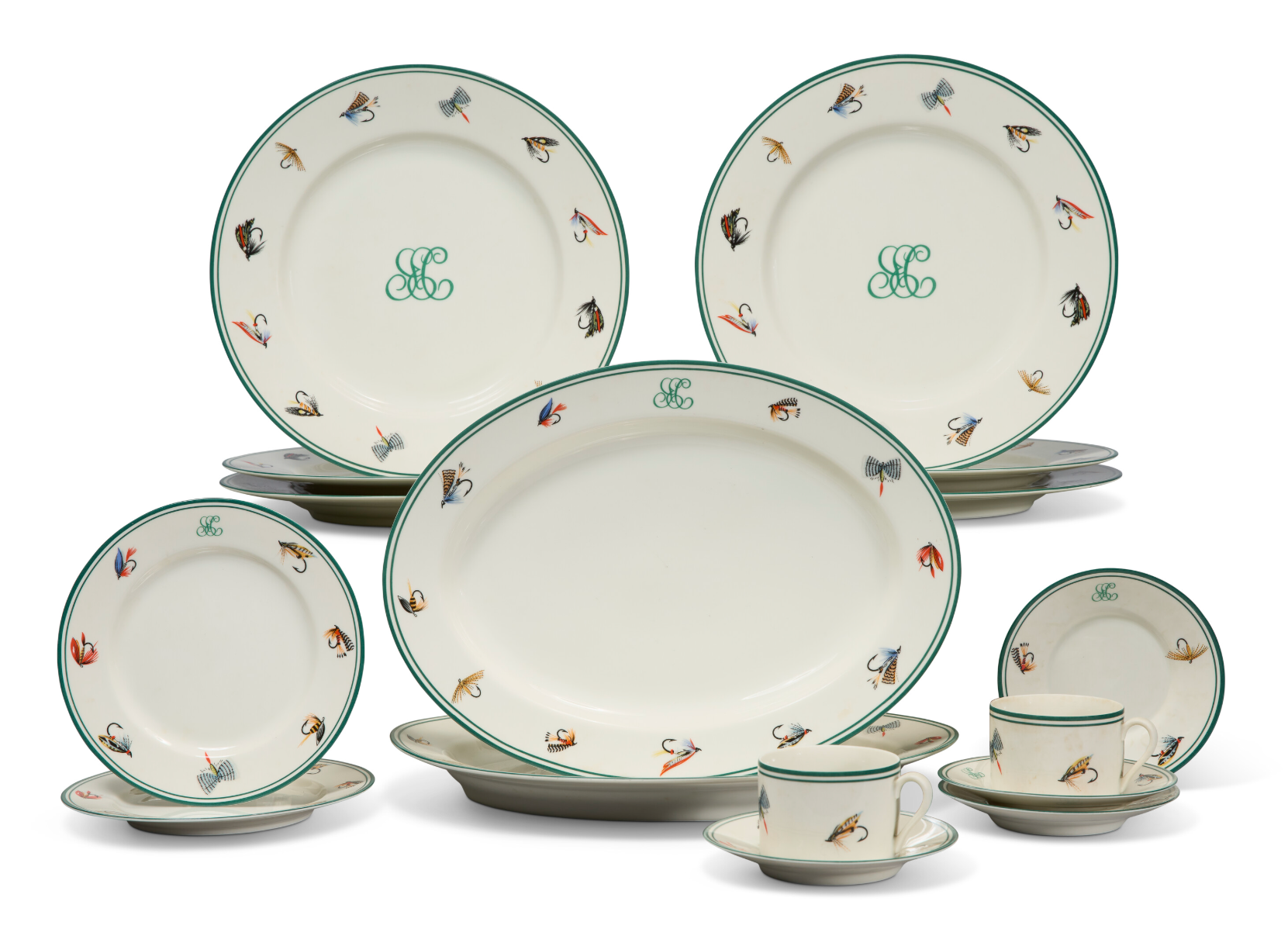 Vintage china dinnerware set decorated with hand-painted fly fishing flies and green monogram trim