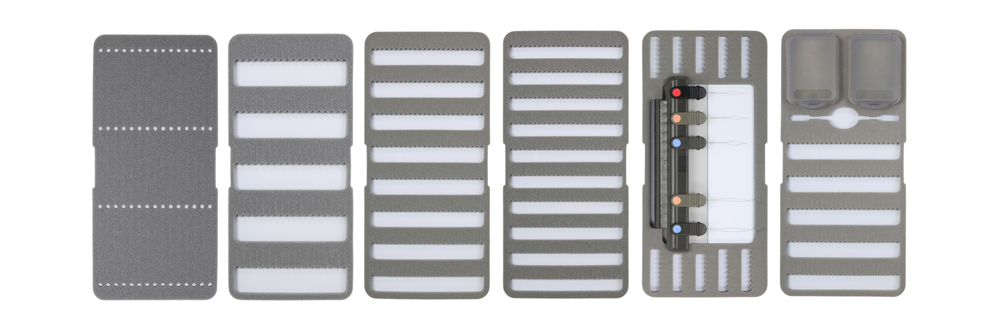 Six C&F Design system foam fly box pages, for various sizes of flies, arranged horizontally in a line