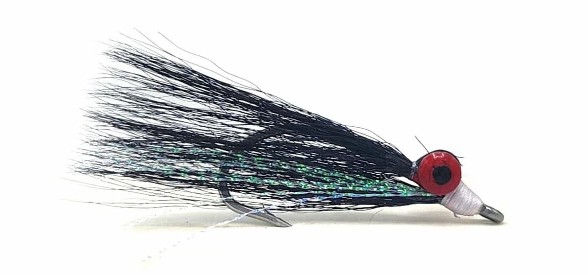 Clouser Deep Minnow fly with black bucktail wing, green flash, and red eyes on a jig-style hook.