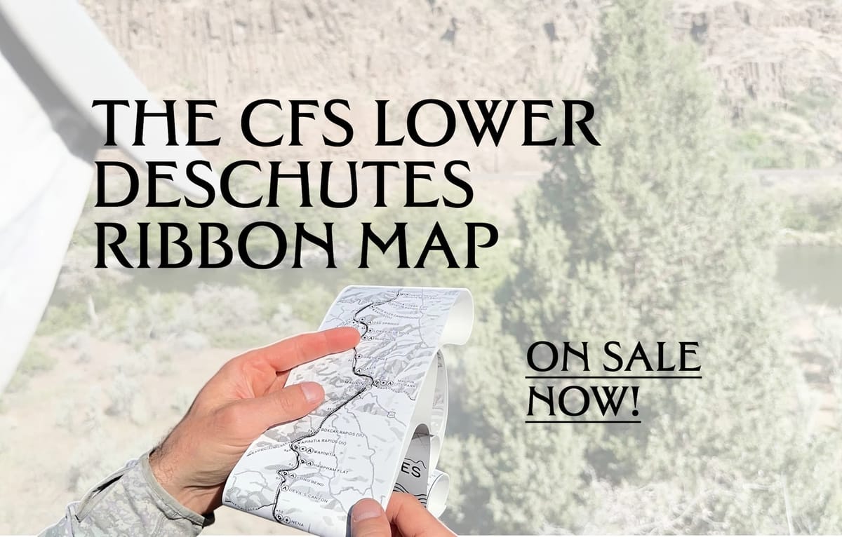 A hand holds an unrolled ribbon map of the Lower Deschutes River against a canyon backdrop, with overlaid text reading "The CFS Lower Deschutes Ribbon Map — On Sale Now!"